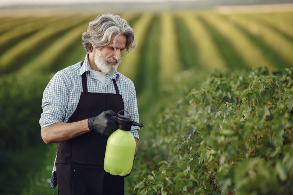 Gardener Watering Plants